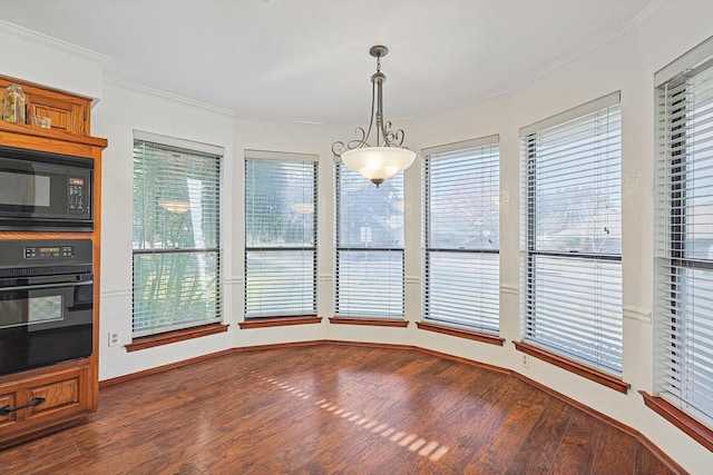 unfurnished dining area featuring ornamental molding and dark hardwood / wood-style floors