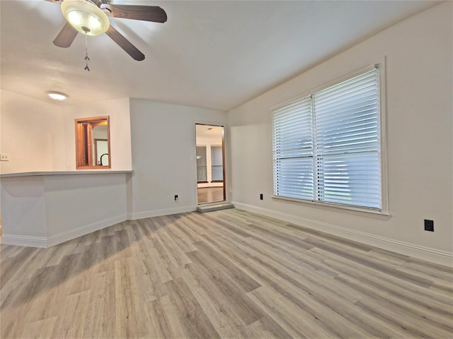 2735 Steamboat Cir, Arlington, TX 76006 - empty room with light wood-style flooring, baseboards, and a ceiling fan