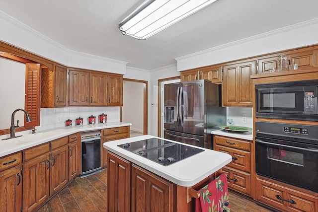 2735 Steamboat Cir, Arlington, TX 76006 - kitchen with black appliances, dark wood-style floors, brown cabinets, light countertops, and ornamental molding