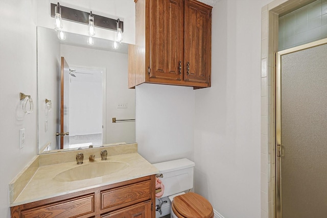 bathroom with vanity, toilet, and walk in shower