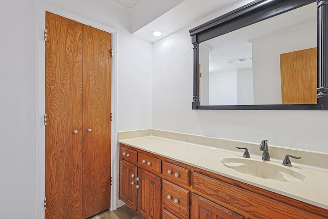 bathroom with vanity and hardwood / wood-style floors