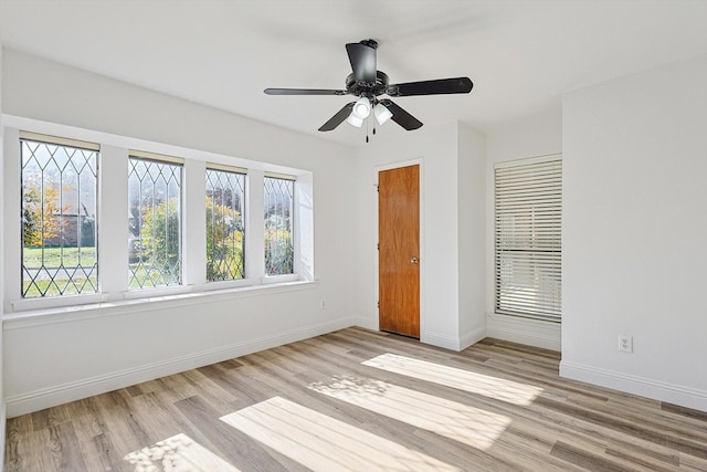 unfurnished bedroom with ceiling fan and light hardwood / wood-style floors