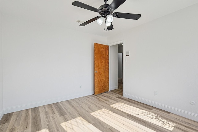 spare room featuring ceiling fan and light wood-type flooring