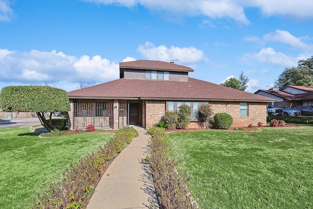 2735 Steamboat Cir, Arlington, TX 76006 - view of front of house featuring brick siding, a front yard, and a shingled roof