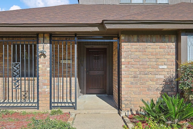 2735 Steamboat Cir, Arlington, TX 76006 - view of exterior entry with brick siding and a shingled roof
