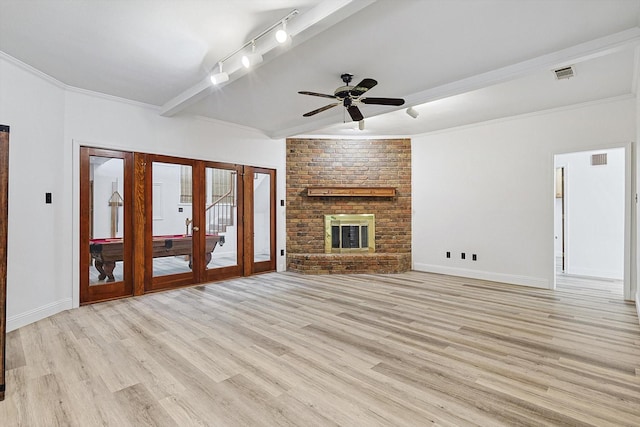 2735 Steamboat Cir, Arlington, TX 76006 - unfurnished living room with light wood finished floors, ceiling fan, baseboards, french doors, and rail lighting