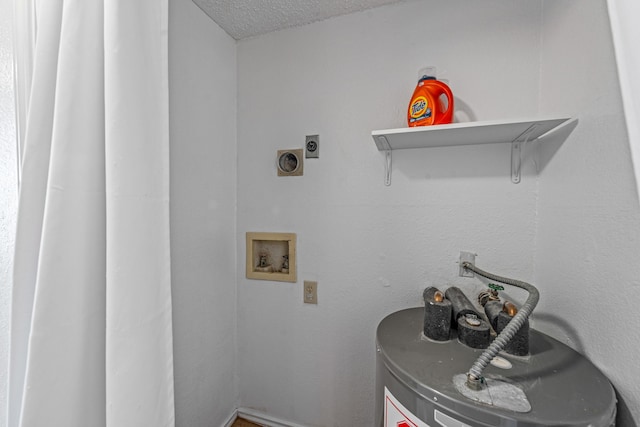 laundry room with hookup for an electric dryer, hookup for a washing machine, water heater, and a textured ceiling