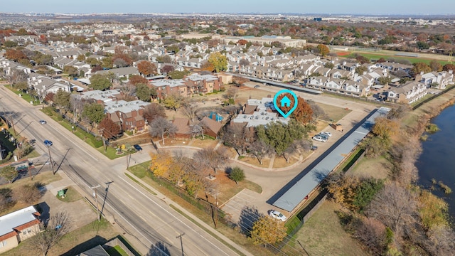 birds eye view of property featuring a residential view and a water view