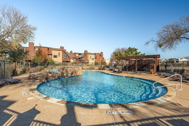 view of swimming pool featuring a pergola and a patio area