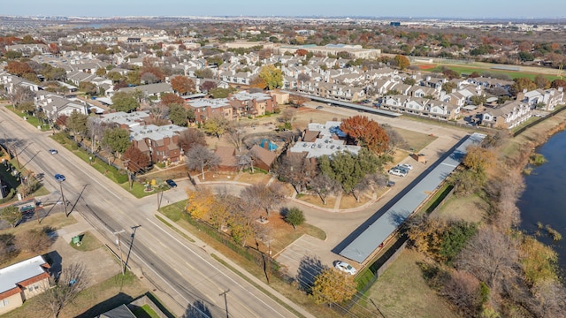 birds eye view of property with a residential view and a water view