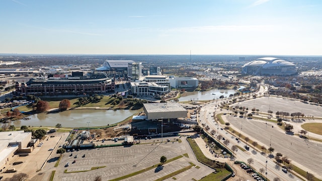 birds eye view of property featuring a water view and a view of city