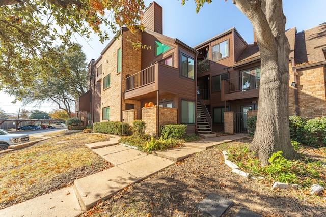 view of property featuring stairway