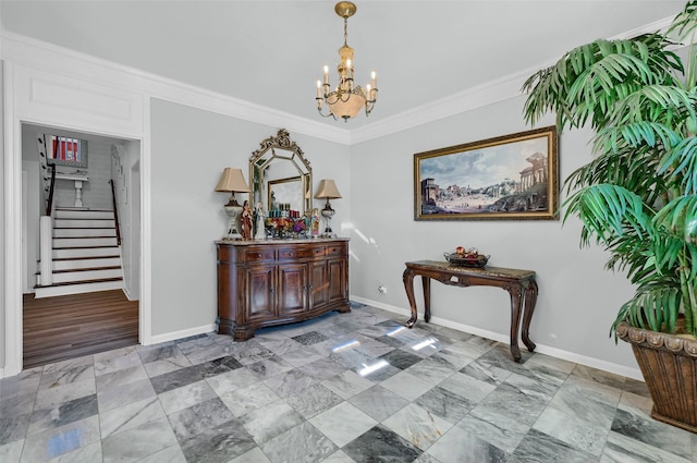 entryway featuring crown molding and a chandelier