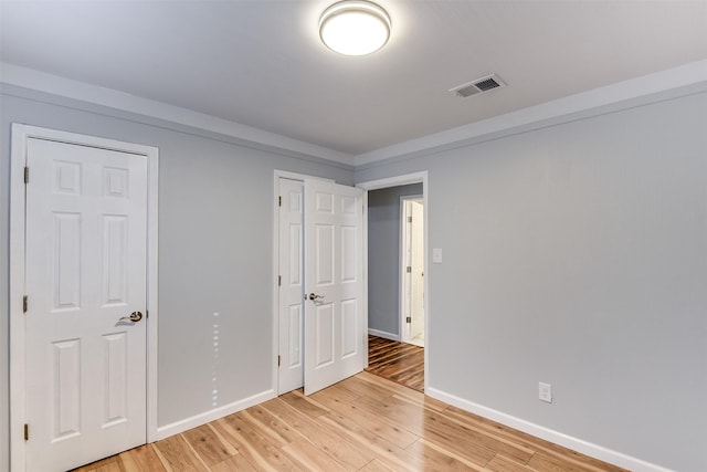 unfurnished bedroom with light hardwood / wood-style flooring