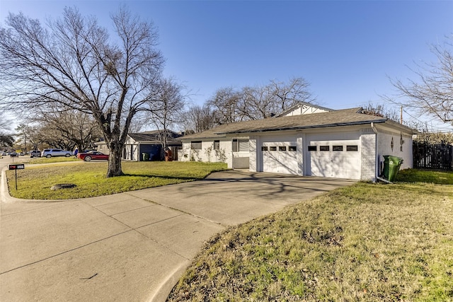 single story home featuring a garage and a front lawn