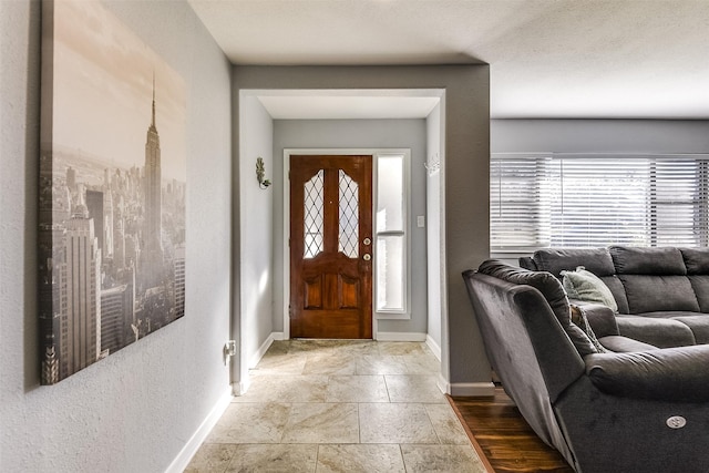 foyer featuring plenty of natural light