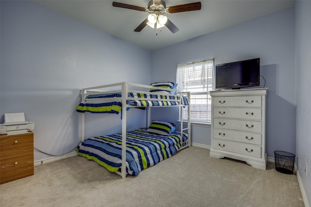 bedroom featuring ceiling fan and light carpet