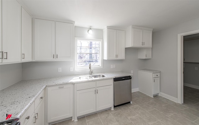 kitchen with white cabinetry, dishwasher, sink, and light stone counters