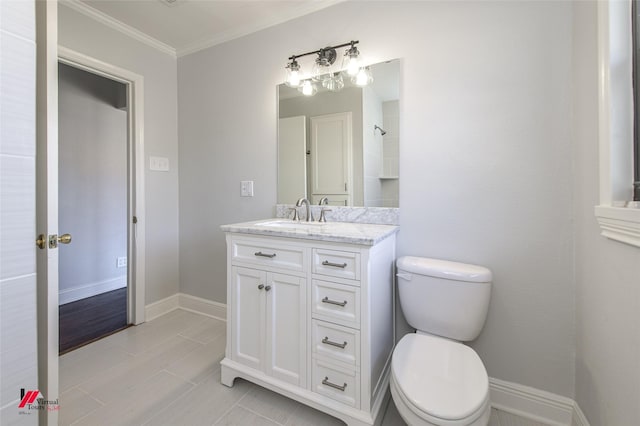 bathroom with vanity, wood-type flooring, ornamental molding, and toilet