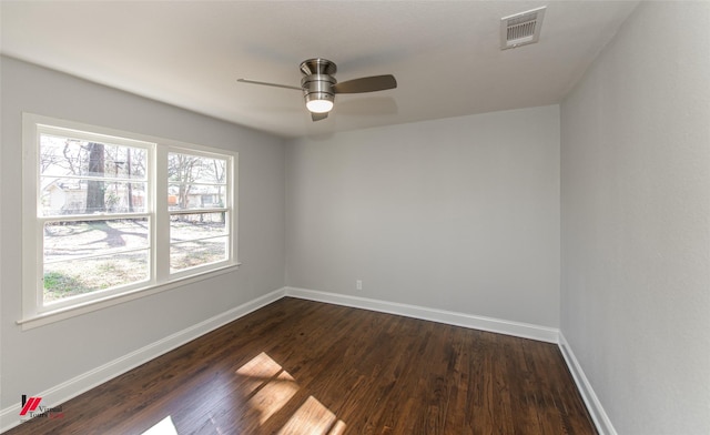 empty room featuring ceiling fan and dark hardwood / wood-style floors