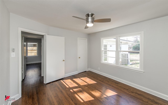 empty room featuring dark hardwood / wood-style floors and ceiling fan