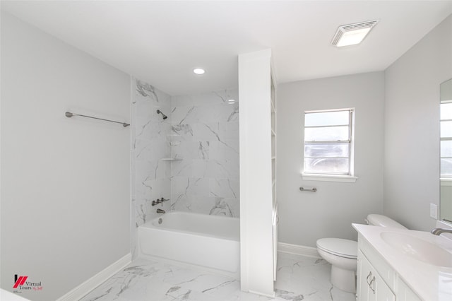 full bathroom featuring tiled shower / bath, vanity, and toilet