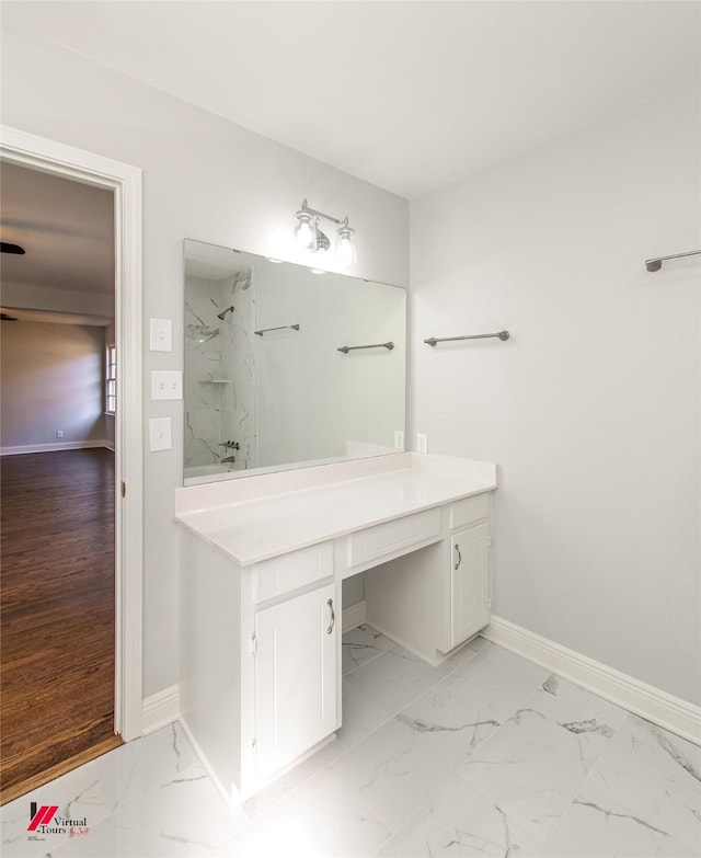 bathroom with vanity and walk in shower