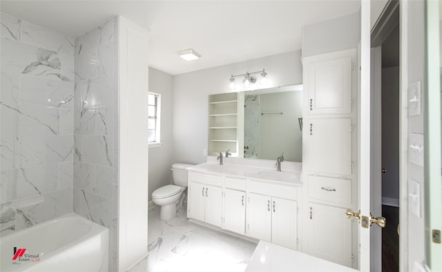 full bathroom featuring vanity, tiled shower / bath combo, and toilet