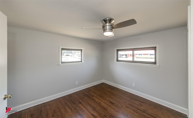 unfurnished room featuring plenty of natural light, dark hardwood / wood-style floors, and ceiling fan