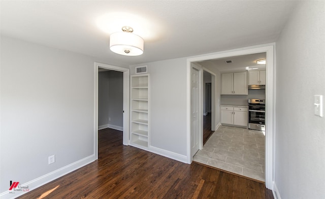 interior space with dark hardwood / wood-style floors