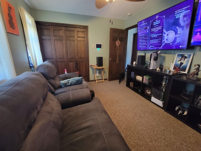 living room with ceiling fan and carpet