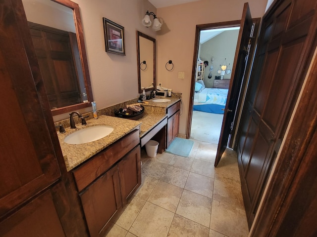 bathroom with tile patterned floors and vanity