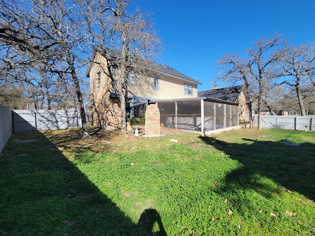 view of yard with a sunroom