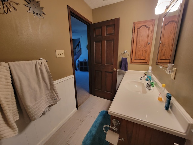 bathroom featuring vanity and wood-type flooring