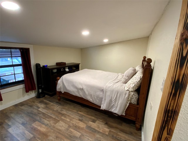 bedroom featuring dark hardwood / wood-style flooring