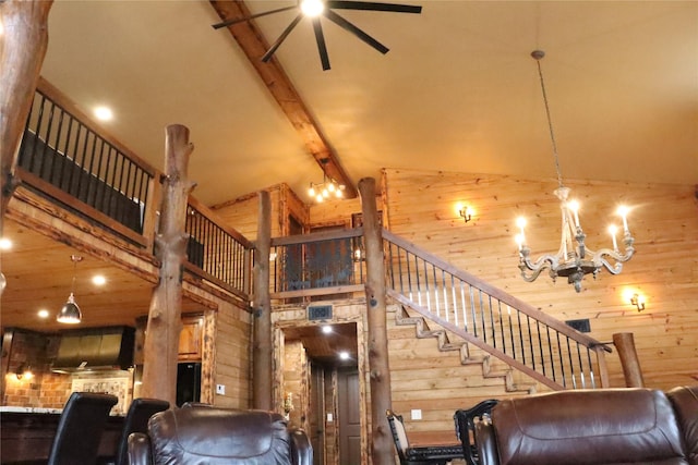 living room featuring beamed ceiling, ceiling fan with notable chandelier, and high vaulted ceiling