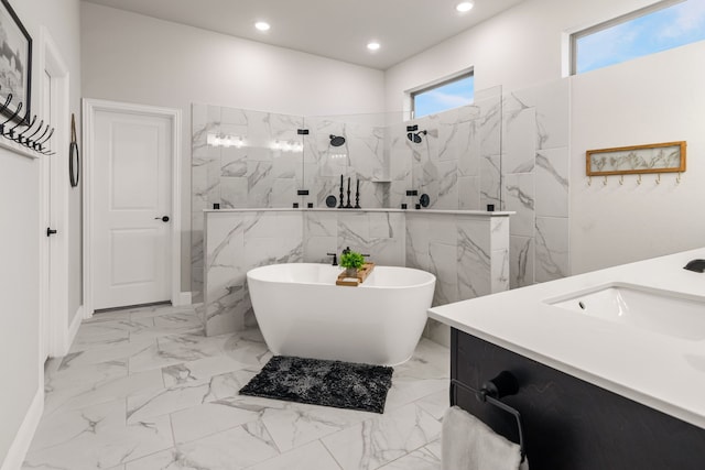 bathroom featuring recessed lighting, a soaking tub, marble finish floor, and a marble finish shower