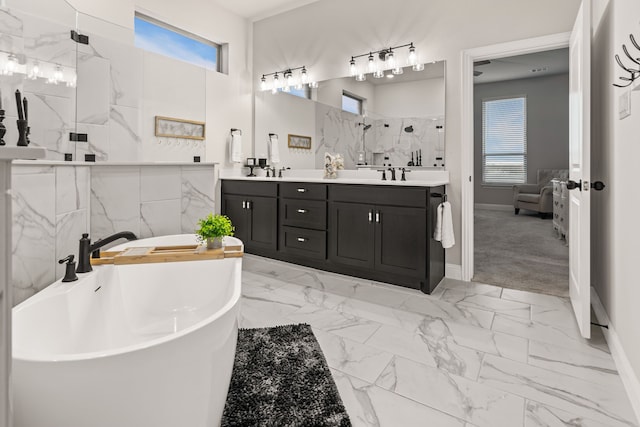 bathroom featuring double vanity, a marble finish shower, a soaking tub, marble finish floor, and a sink