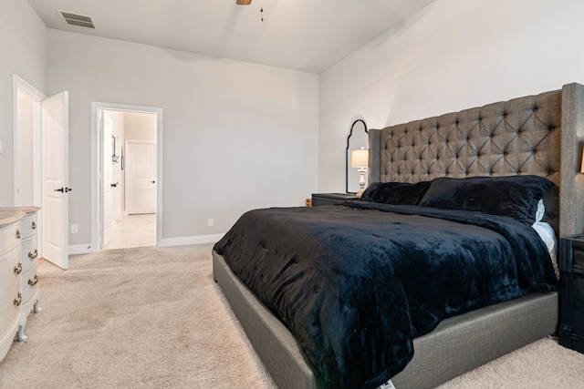 bedroom featuring light carpet