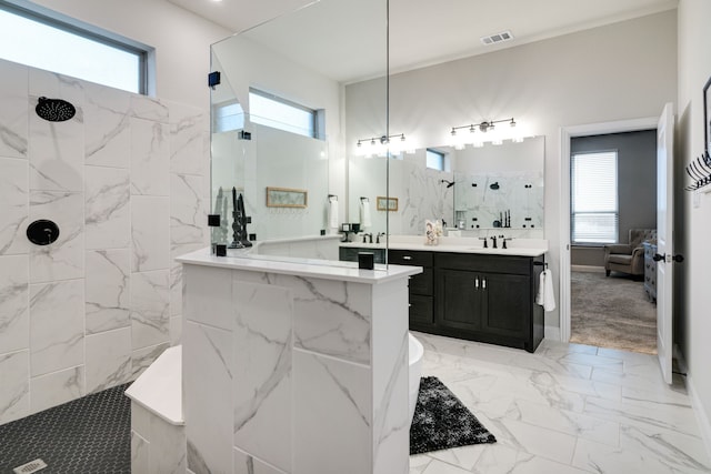 full bathroom with marble finish floor, a marble finish shower, visible vents, ensuite bathroom, and vanity