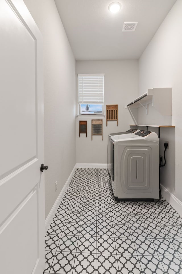 laundry room with washer and clothes dryer