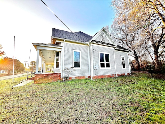 exterior space featuring a yard and covered porch