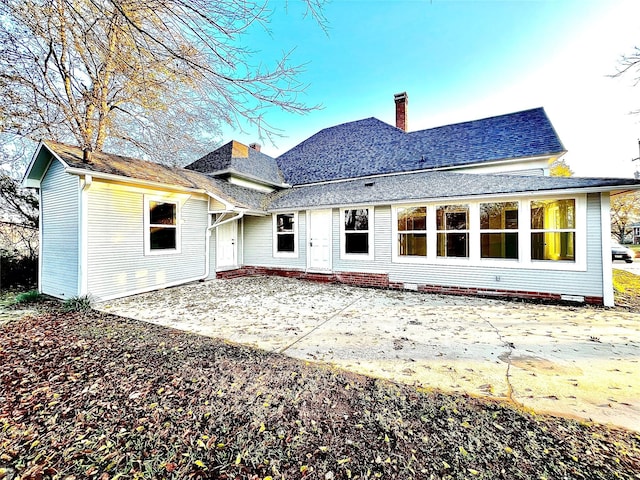 rear view of property with a patio area