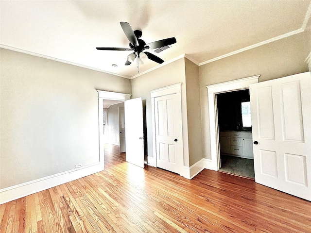 unfurnished bedroom with crown molding, ceiling fan, ensuite bath, and light hardwood / wood-style flooring