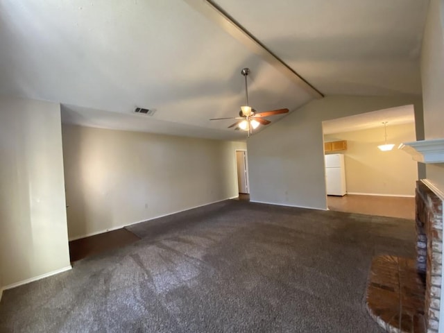 unfurnished living room featuring vaulted ceiling, ceiling fan, and dark carpet