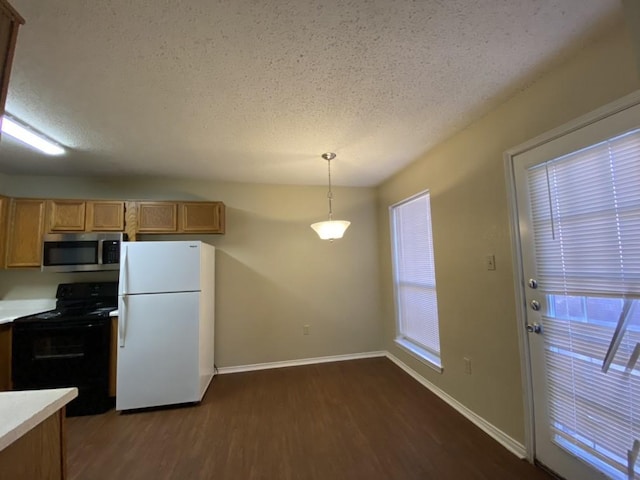 kitchen featuring dark hardwood / wood-style flooring, hanging light fixtures, white fridge, electric range, and a textured ceiling