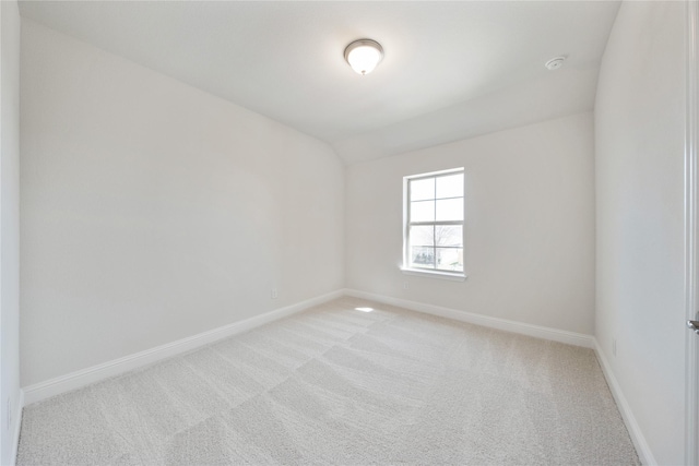 116 Old Glory Ln, Forney, TX 75126 - empty room featuring light carpet, baseboards, and vaulted ceiling