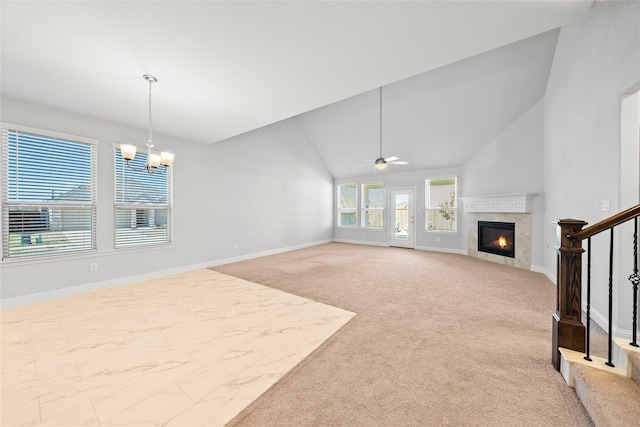 6225 Kent Ln, Celina, TX 76227 - unfurnished living room with a warm lit fireplace, a chandelier, vaulted ceiling, baseboards, and a ceiling fan
