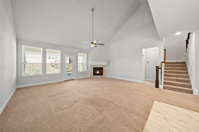 6225 Kent Ln, Celina, TX 76227 - unfurnished living room with light colored carpet, a ceiling fan, high vaulted ceiling, stairs, and baseboards