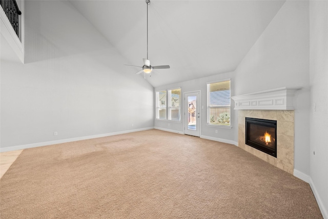 6225 Kent Ln, Celina, TX 76227 - unfurnished living room with light carpet, high vaulted ceiling, a tiled fireplace, baseboards, and ceiling fan